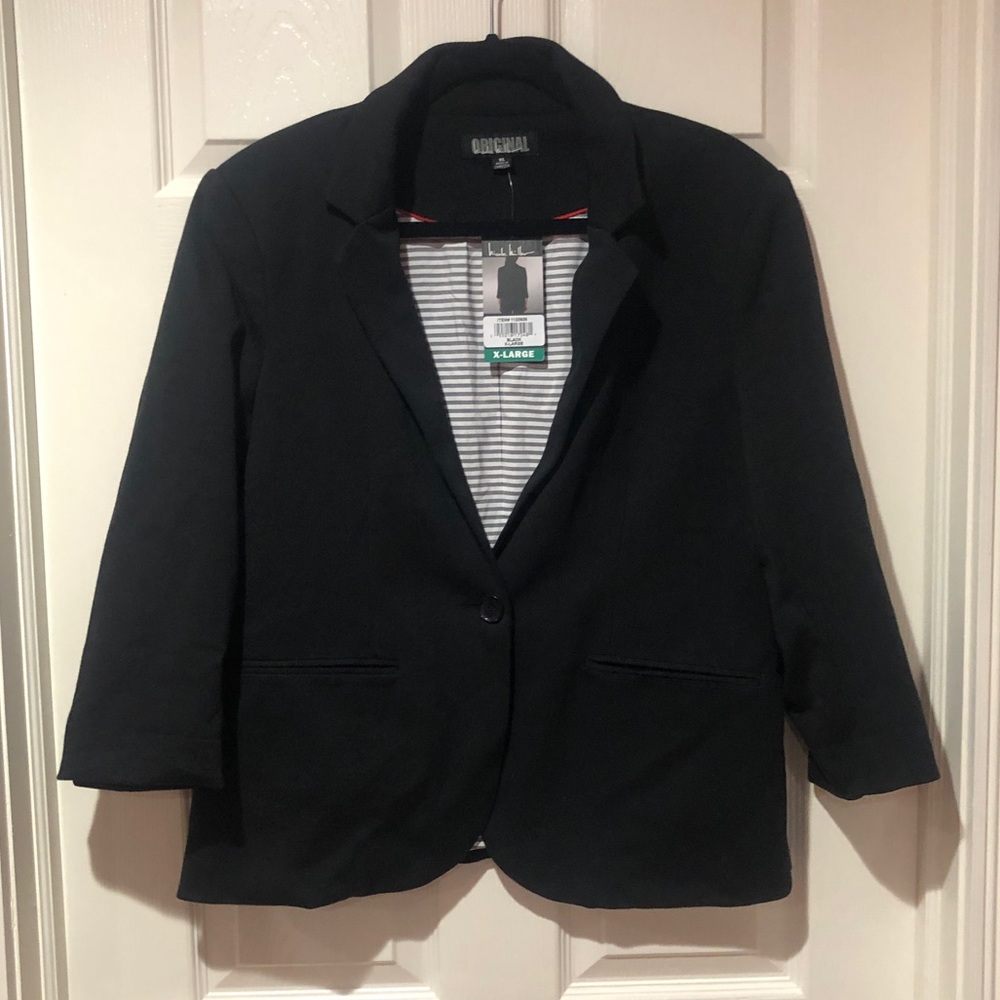 A fitted design and an open front blazer.